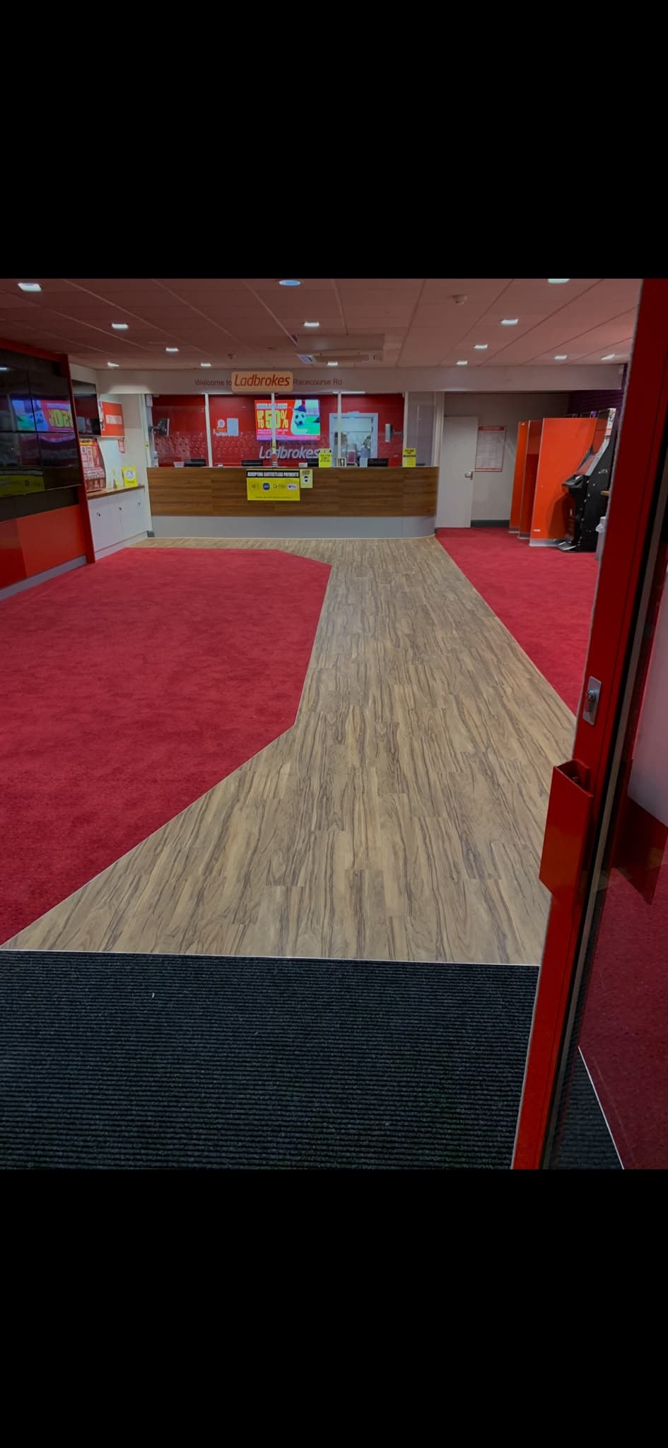 Commercial vinyl flooring fitted in a betting shop reception by Philip B Flooring